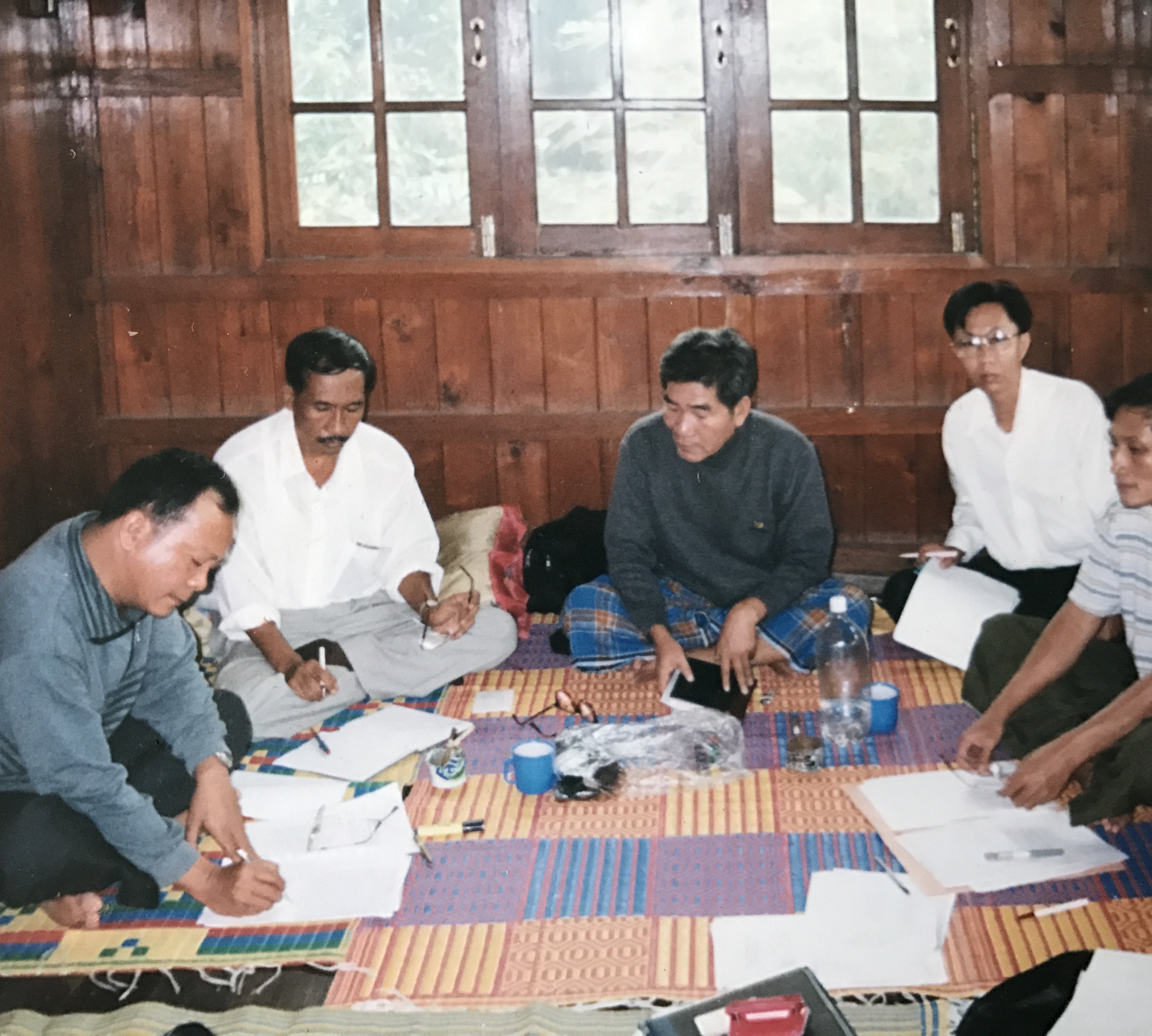 Meeting of Burma Lawyers' Council members in a wooden house